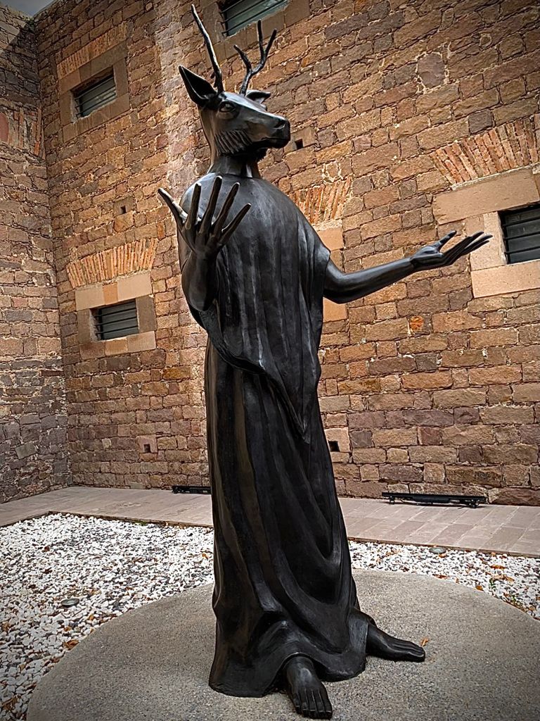 Bronze sculpture of a figure with a human body and deer head by Leonora Carrington